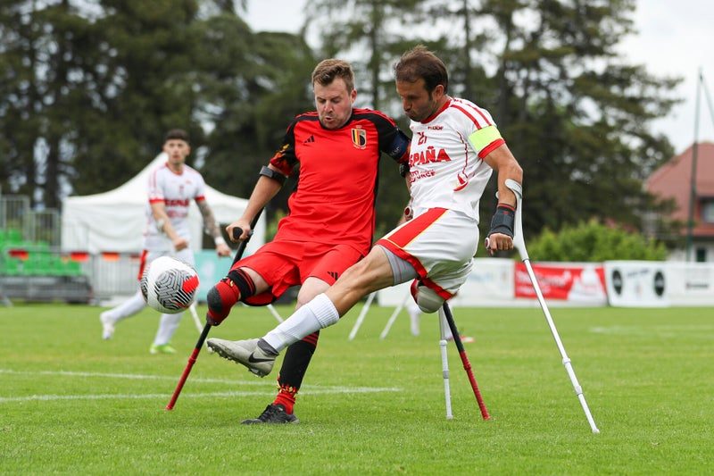 Player in Belgium’s red shirt clears the ball during the European Championship