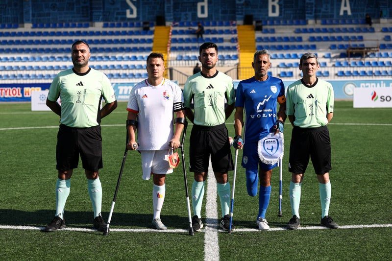 The captains and referees before kick-off
