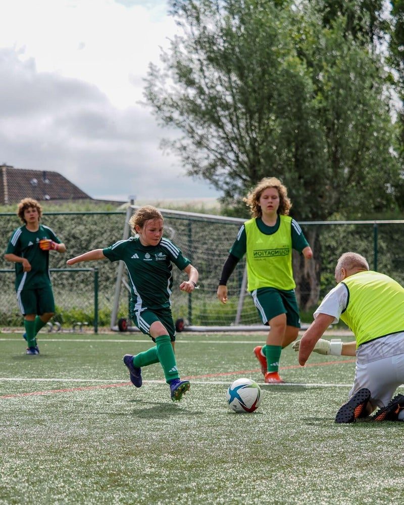 Children play a small-sided game at the junior camp